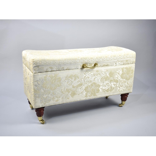 473 - A Modern Upholstered Blanket Box with Hinged Lid, Turned Wooden Feet with Brass Castors, 92cms Wide