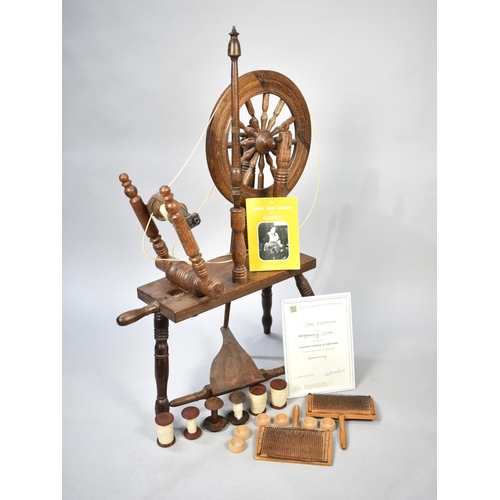 476 - A Mid/Late 20th Century Oak Spinning Wheel with Accessories, Carding Combs and Certificate