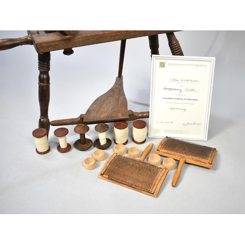 476 - A Mid/Late 20th Century Oak Spinning Wheel with Accessories, Carding Combs and Certificate