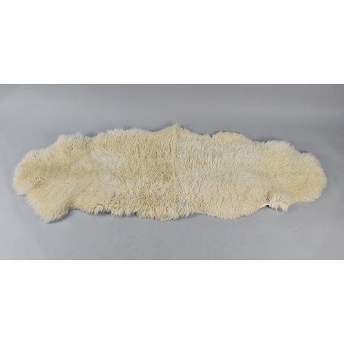 489 - A Sheepskin Rug, Approx 180x66cms Approx