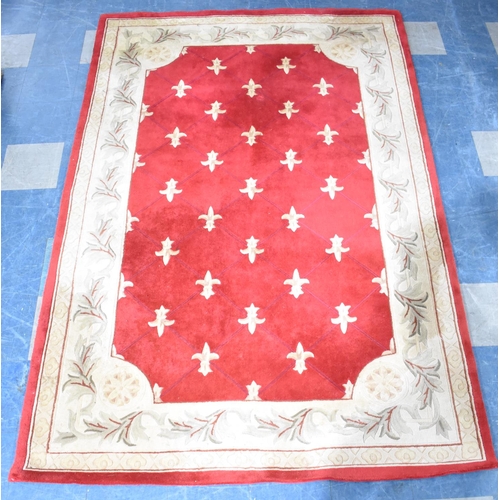 496 - A Modern Patterned Rug on Red Ground, 274x181cms