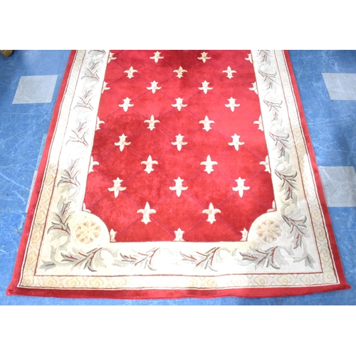 496 - A Modern Patterned Rug on Red Ground, 274x181cms