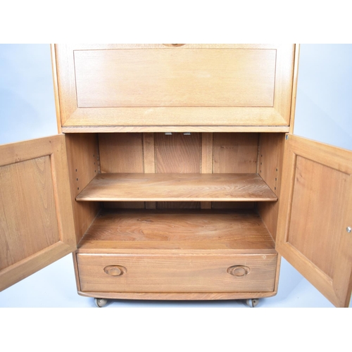 499 - An Ercol Side Cabinet with Pull Down Front, Cupboard Centre, Long Drawer to Base together with Three... 