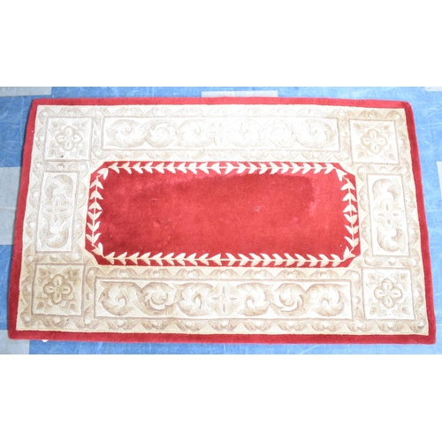 505 - A Modern Patterned Rug on Red Ground, 150x92cms