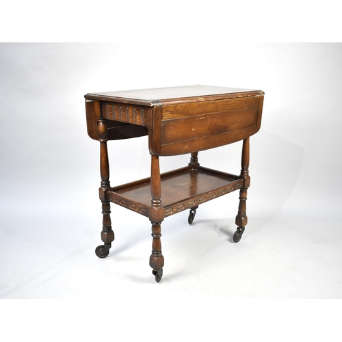 520 - A Mid 20th Century Oak Two Tier Drop Leaf Trolley, 67cms Wide