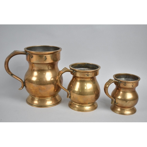 63 - A Set of Three Georgian Style Brass Graduated Measures, Tallest 13.5cms