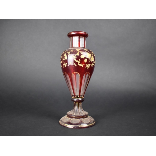 66 - A Bohemian Ruby Glass and Gilt Decorated Vase together with a Plain Glass Lustre, 21cms High