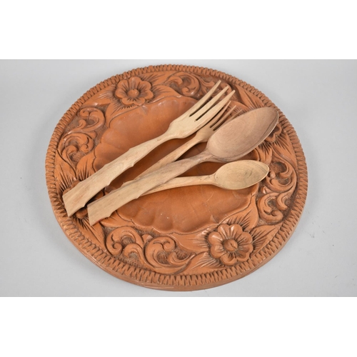 77 - A Mid 20th Century Carved Circular Wooden Bread Plate together with Wooden Spoons and Forks