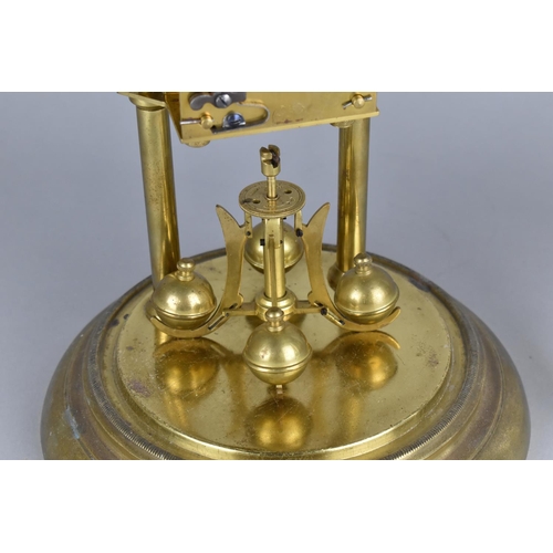 82 - A Mid 20th century Brass Pillar Clock Under Glass Dome, Requires New Suspension, 31cms High