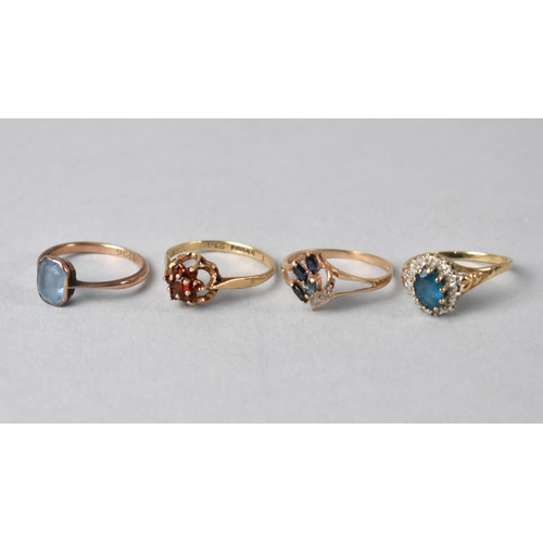 412 - Four 9ct Gold and Jewelled Mounted Dress Rings to include Garnet, Topaz, Sapphire and Diamond Mounte... 