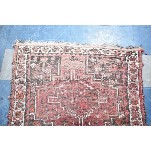 525 - A Patterned Woolen Rug, Somewhat Worn, 157x114cms