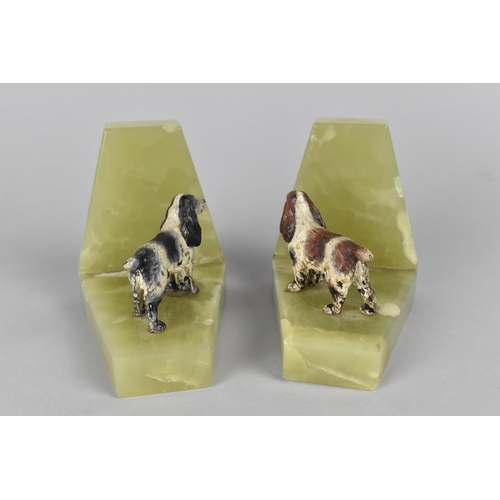 16 - A Pair of Onyx Bookends Mounted with Cold Painted Spaniel Figures, 9.5cms High