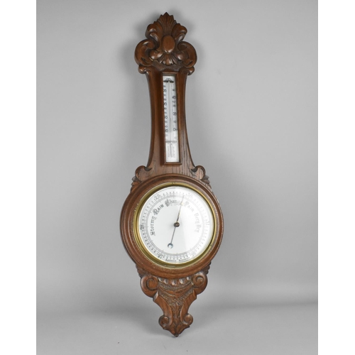 176 - A Late Victorian/Edwardian Carved Oak Onion Topped Wheel Barometer with Thermometer