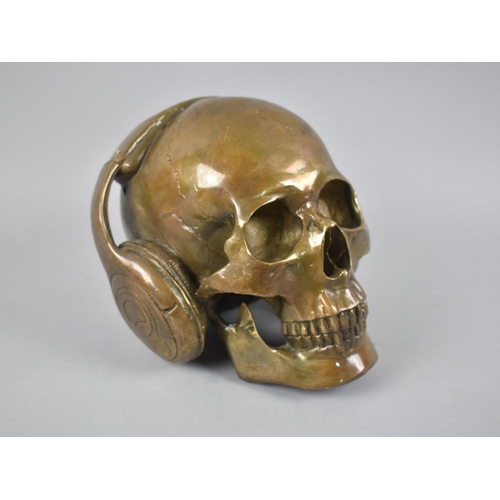 193 - A Modern Novelty Bronze, Skull with Headphone, 16cms High