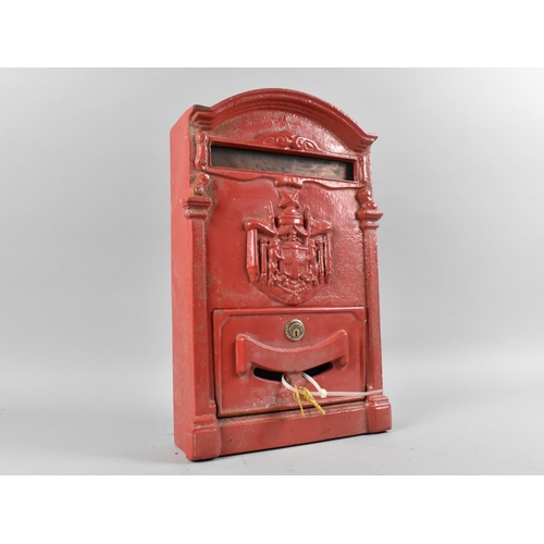 199 - A Red Painted Cast Metal Wall Hanging Post Box, 39cms High, With Keys