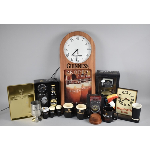 214 - A Collection of Various Modern Guinness Memorabilia to include Gift Sets, Wall Clock, Bar Clock Etc