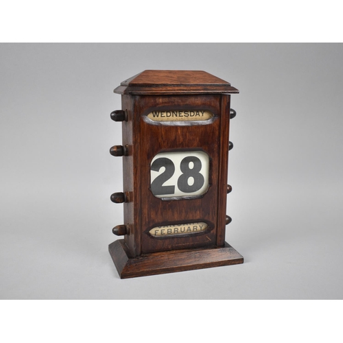 25 - An Edwardian Oak Desktop Perpetual Calendar with Day, Date and Month, 22cms High