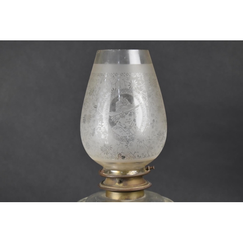 26 - A Victorian Oil Lamp with Pierced Cast Iron Base, Glass Reservoir and Etched Glass Shade, 46cms High