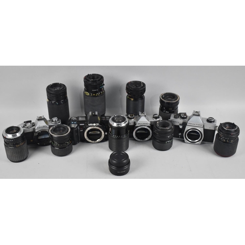 261 - A Collection of Four 35mm Camera Bodies and Various Telescopic and Other Lenses