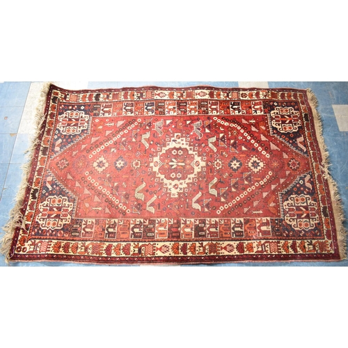 541 - A Vintage Patterned Woollen Rug on Red Ground, 257x160cm