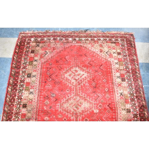 545 - A Patterned Rug on Red Ground, 190x154cm