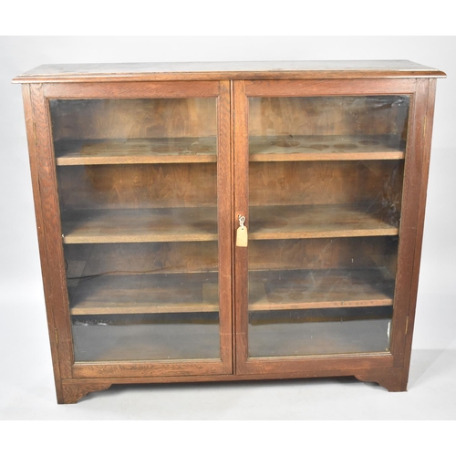 549 - An Edwardian Oak Glazed Bookcase with Three Inner Shelves, 124cm wide