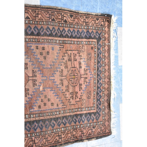 552 - A Patterned Rug on Brown Ground, 152x94cm