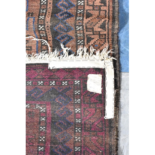 552 - A Patterned Rug on Brown Ground, 152x94cm