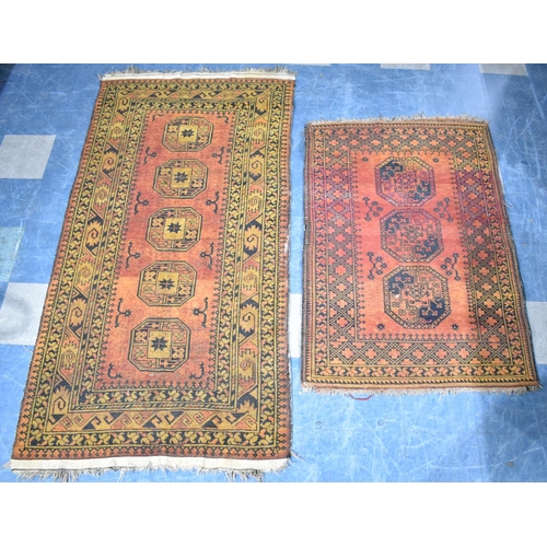 555 - Two Matching Patterned Rugs on Blue Ground, the Larger 220x113cm and Smaller 150x102cm