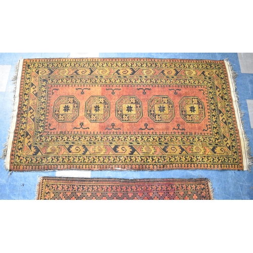 555 - Two Matching Patterned Rugs on Blue Ground, the Larger 220x113cm and Smaller 150x102cm