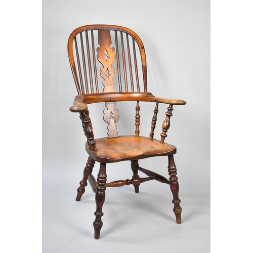 559 - A 19th Century Elm Seated Spindle Back Kitchen Armchair with Pierced Splat