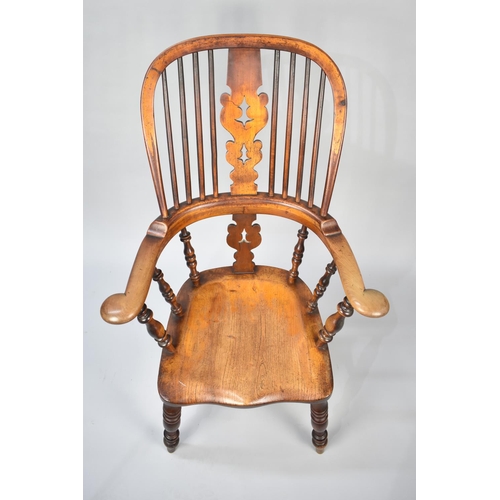 559 - A 19th Century Elm Seated Spindle Back Kitchen Armchair with Pierced Splat