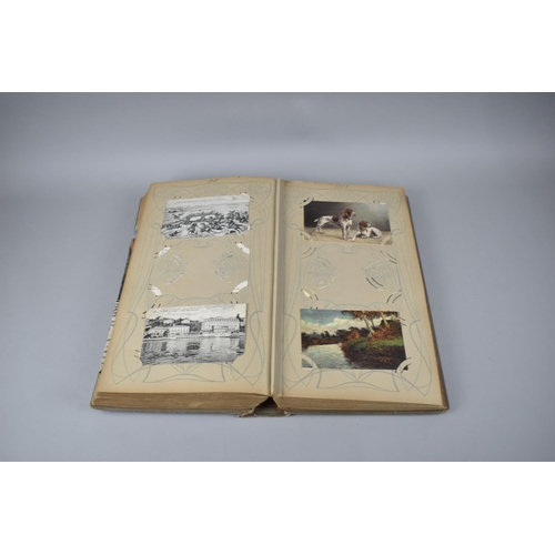 65 - A Large Late Victorian German Postcard Album, The Early Pages Dated from 1899 and Later Cuttings May... 