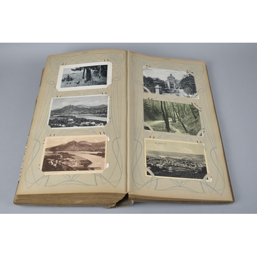 65 - A Large Late Victorian German Postcard Album, The Early Pages Dated from 1899 and Later Cuttings May... 