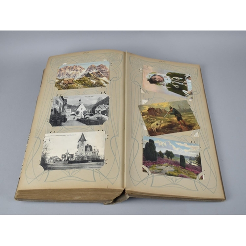 65 - A Large Late Victorian German Postcard Album, The Early Pages Dated from 1899 and Later Cuttings May... 