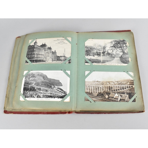 66 - An Early 20th Century Postcard Album containing Mixed Coloured and Monochrome Cards to include Views... 