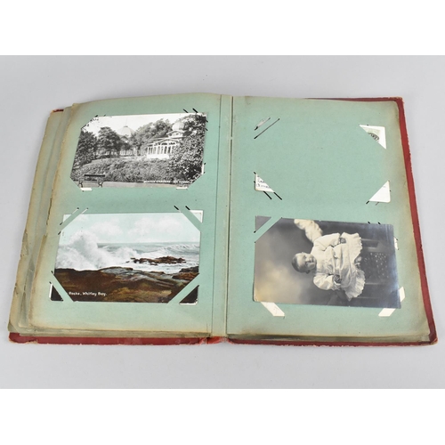 66 - An Early 20th Century Postcard Album containing Mixed Coloured and Monochrome Cards to include Views... 