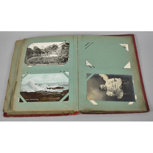 66 - An Early 20th Century Postcard Album containing Mixed Coloured and Monochrome Cards to include Views... 