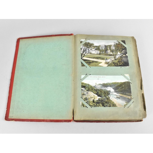 66 - An Early 20th Century Postcard Album containing Mixed Coloured and Monochrome Cards to include Views... 