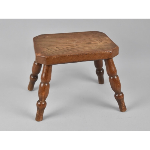 67 - A Vintage Rectangular Milking Stool with Turned Supports, 23cms by 16.5cm by 20cms High