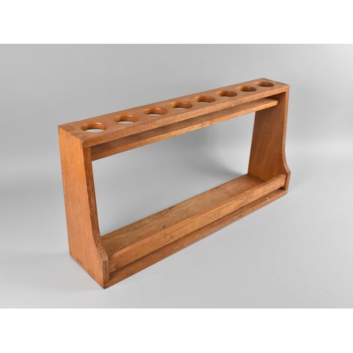 70 - A Modern Wooden Spice Rack with Eight Circular Recesses and Open Base, 58cms Wide