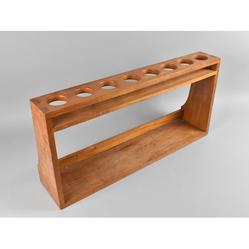 70 - A Modern Wooden Spice Rack with Eight Circular Recesses and Open Base, 58cms Wide