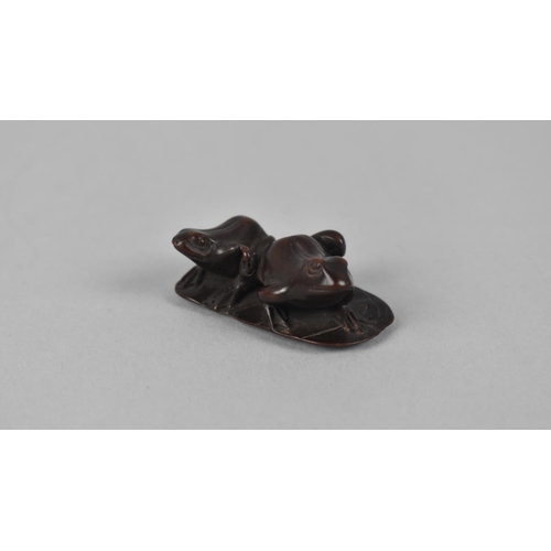 72 - A Carved Wooden Netsuke Depicting Two Frogs on Lilypad, Signed to Base, 4.5cms Wide