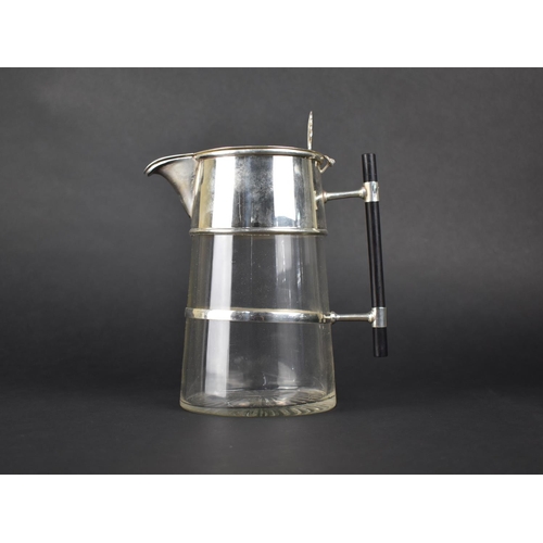 75 - A Reproduction Arts and Crafts Style Silver Plated and Glass Lidded Jug with Ebonized Handle, 24.5cm... 