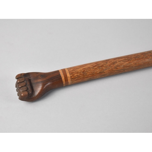 92 - A Walking Cane with Carved Wooden Handle in the Form of a Clenched Fist and Inscribed 