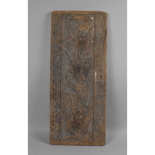 99 - An Early Weathered Carved Panel depicting in Relief Thistles, Scrolls, 72x30cms