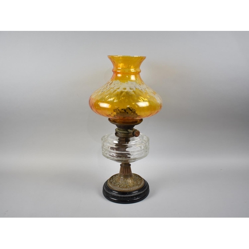 32 - A Late Victorian Oil Lamp with Brass Support, Glass Reservoir and Later Coloured Glass Shade, 46cms ... 