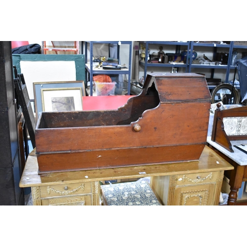 537 - A 19th Century Stained Pine Cradle of Boat Form with Top Canopy and Tapering Body, 98x38x54cms High