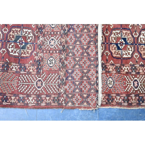 554 - A Vintage Patterned Rug, 168x105cms