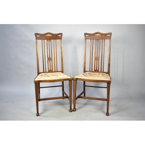 560 - A Pair of String Inlaid Edwardian Side Chairs with tapestry Seats Depicting Oriental Scenes